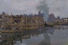 Shortly after settling in Argenteuil, Monet grew fond of painting as his subject the bridge carrying the road into the town centre. The bridge was still in the process of reconstruction at that point during the winter of 1871. It had in fact been burnt down during the war of 1870 and the Prussian occupation of Paris. It was rebuilt in the same style and using the same materials (wood and stone). Monet then painted the view of a bridge supported by scaffolding over the grey-blue waters of the Seine. This complex subject of interlinked beams seems to have made a great impression on him. He assigns great importance to it in this painting, also playing with its reflection on the river's shimmering surface and setting it in stark opposition to the emptiness of the dark sky and the stillness of the water.