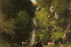 a-family-of-deer-in-a-landscape-with-a-waterfall