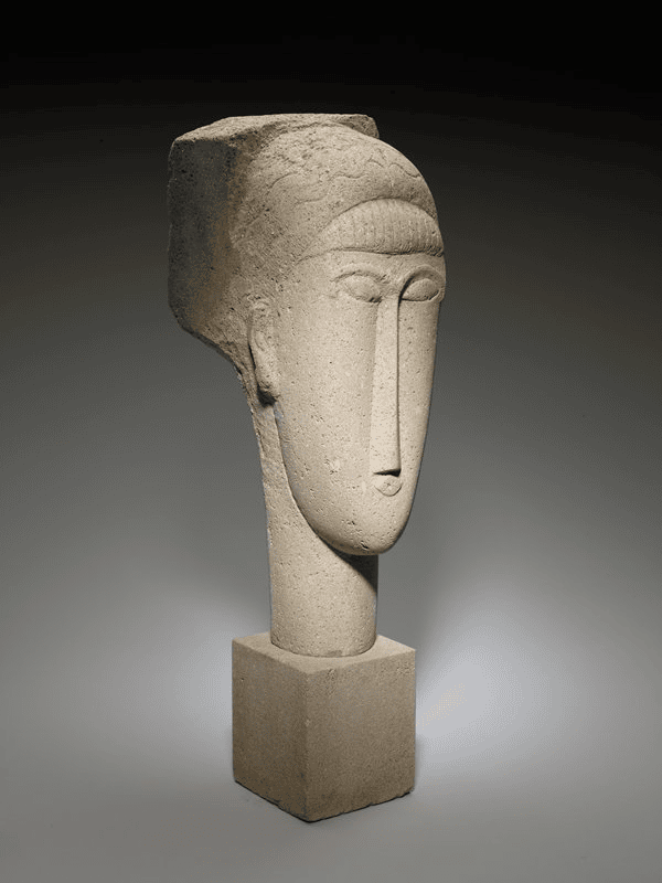 Modigliani'nin kireçtaşından Kadın Başı heykeli: uzun boyun ve ince uzun burun