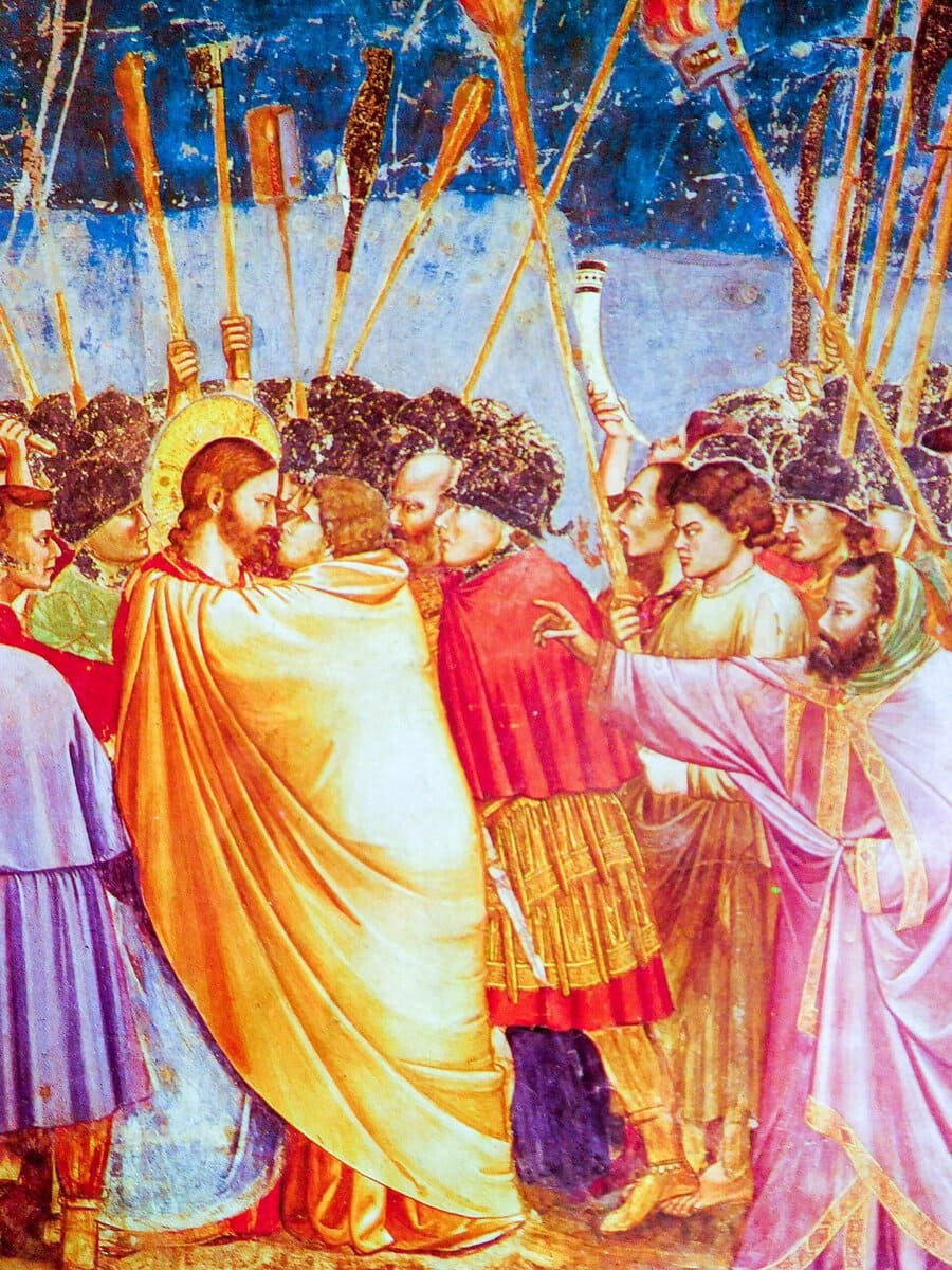 Giotto'nun Yahuda'nın Öpücüğü freski: sarı pelerinli Yahuda ve İsa karşı karşıya